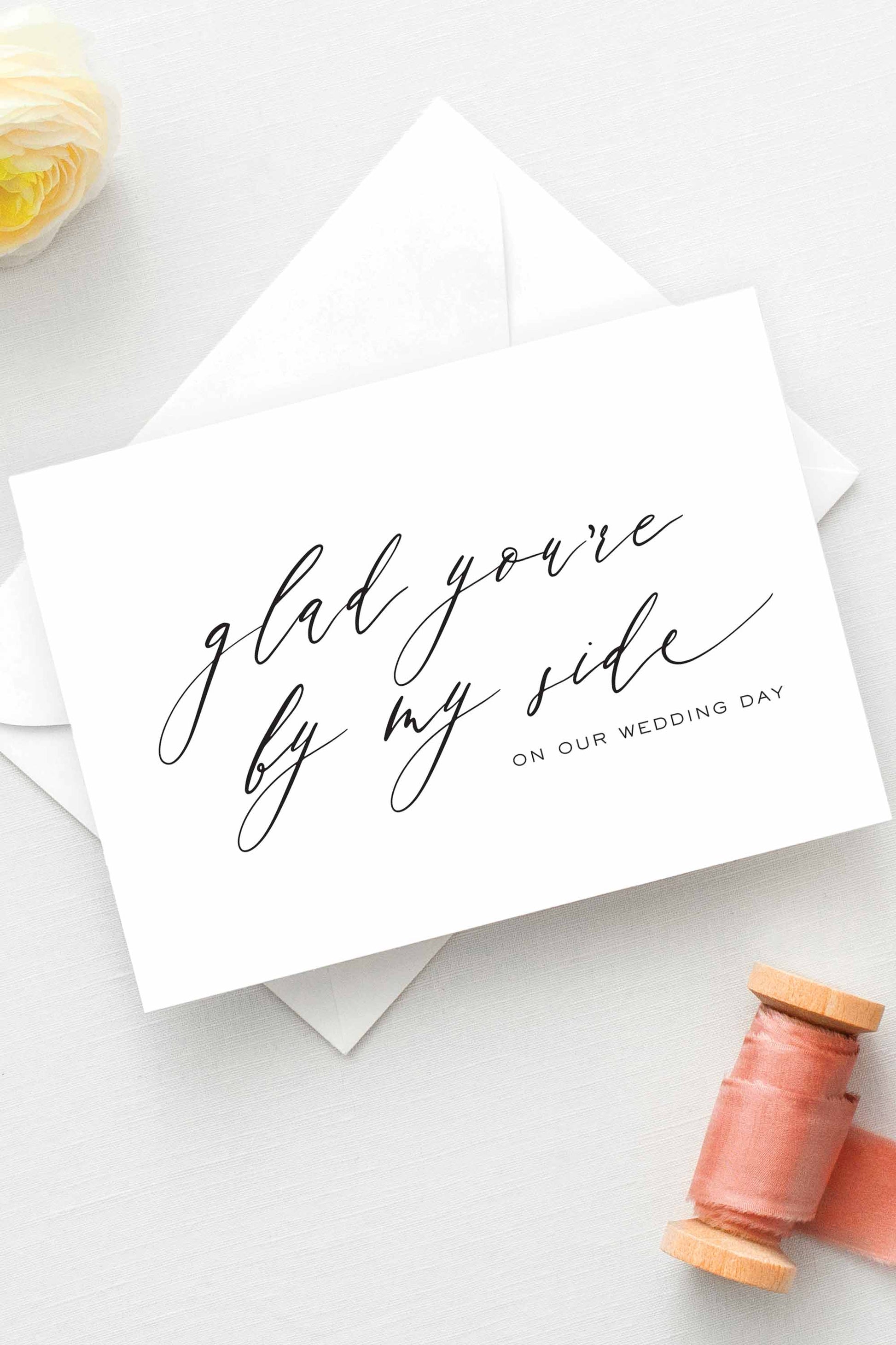 Minimalist wedding thank you card for bridesmaids and groomsmen, featuring elegant calligraphy on white cardstock