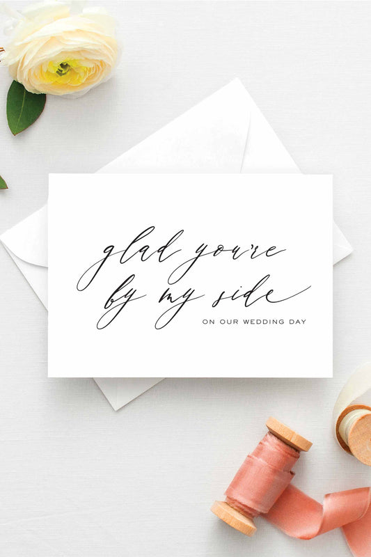 Minimalist wedding thank you card for bridesmaids and groomsmen, featuring elegant calligraphy on white cardstock