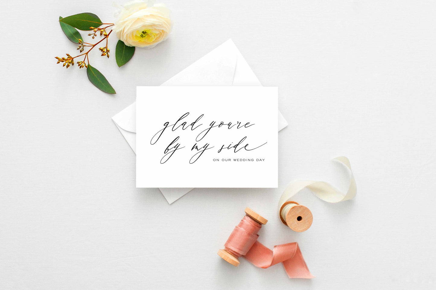 Minimalist wedding thank you card for bridesmaids and groomsmen, featuring elegant calligraphy on white cardstock